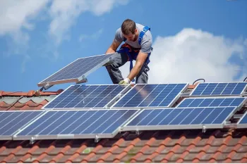 man-installing-solar-panels-roof-copy