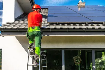 professional-worker-installing-solar-panels-roof